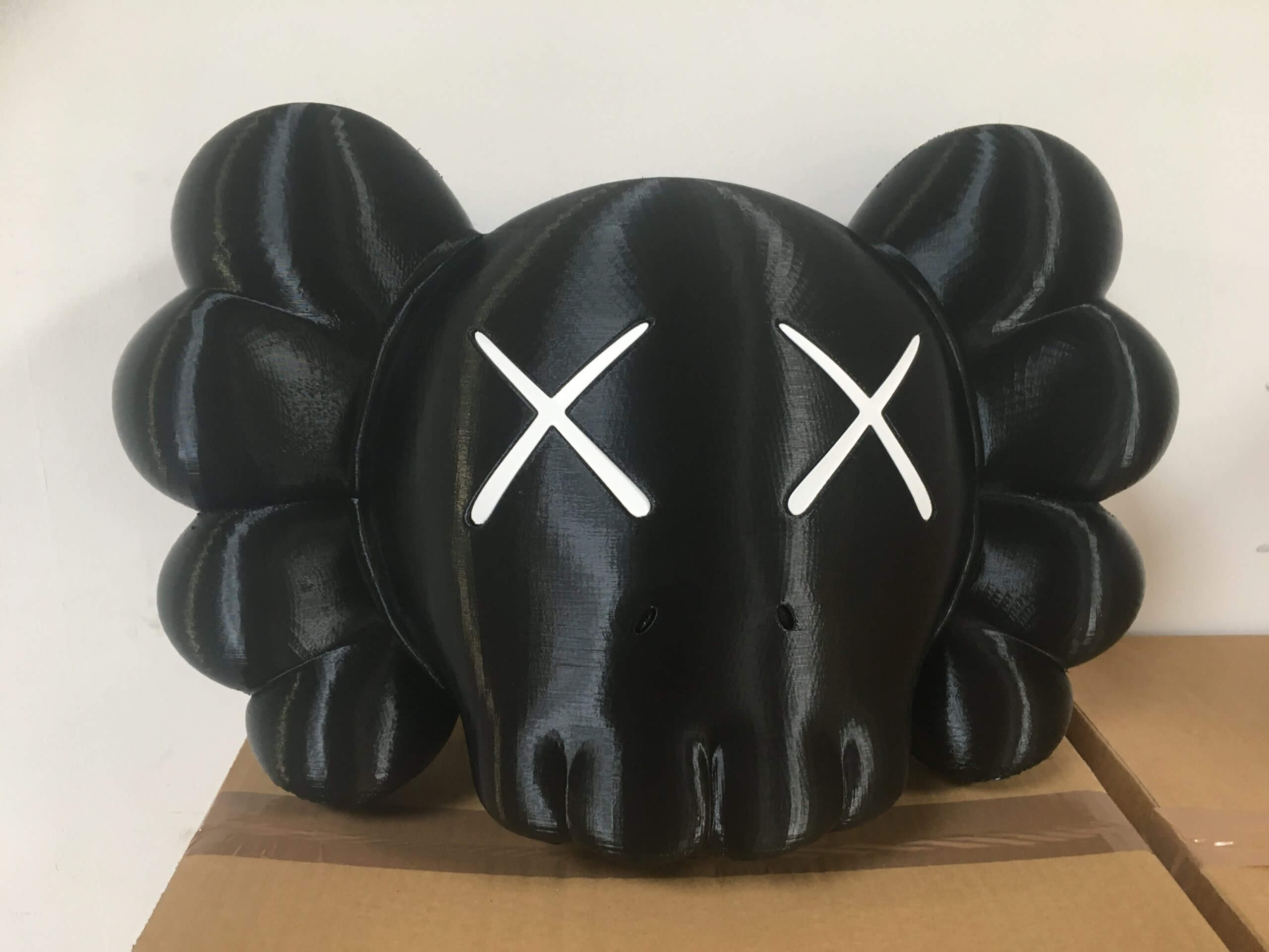 Détail yeux bleus statue Kaws impression 3D modules interchangeables PAMI3D